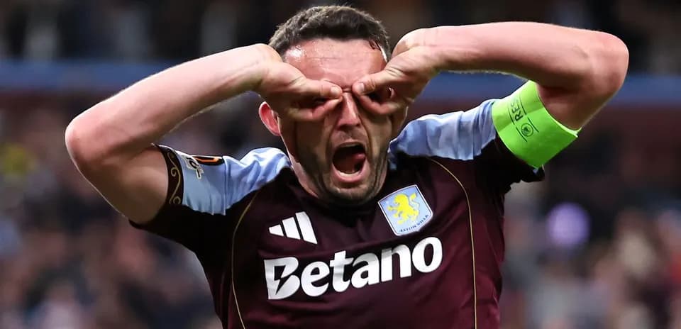 Player celebrating with hands on face in stadium