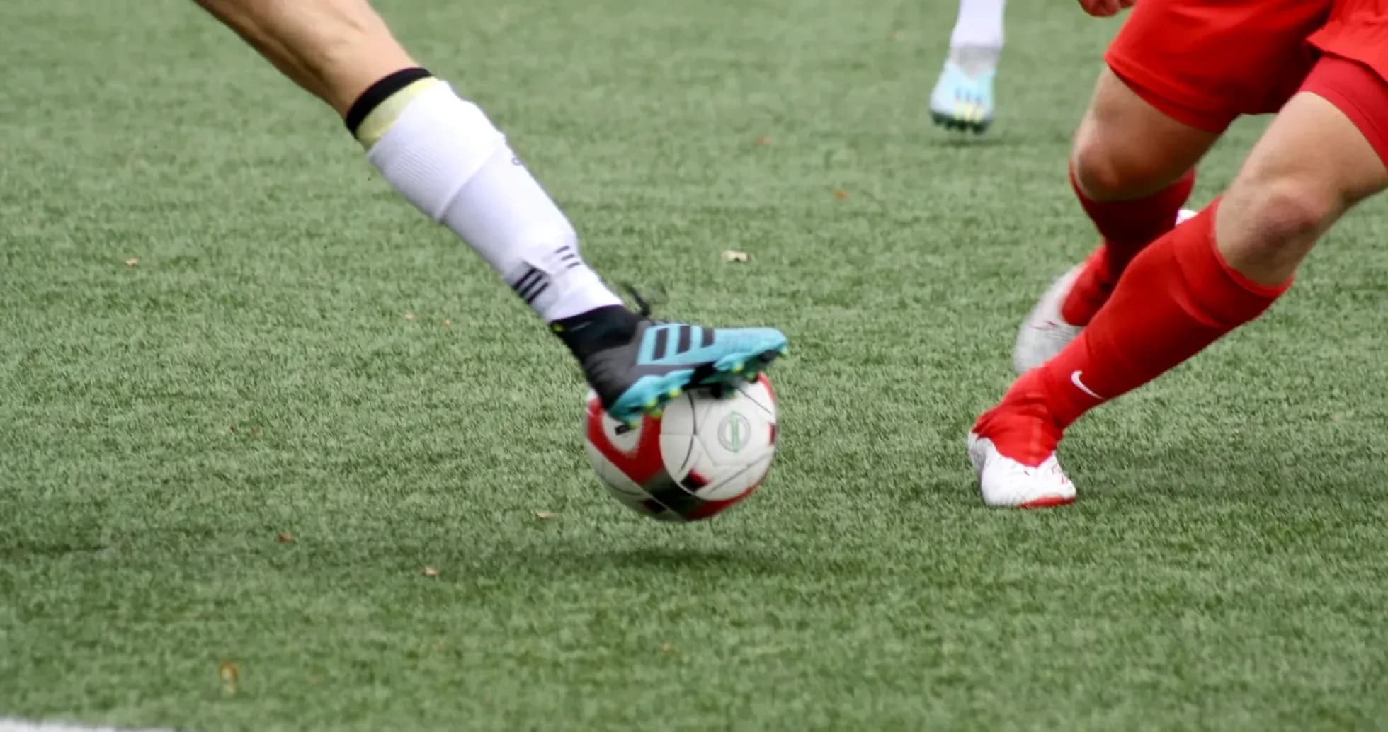 Players contesting for the ball on the field