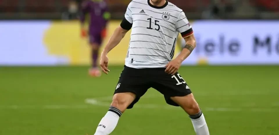 Player in Germany kit preparing to pass ball
