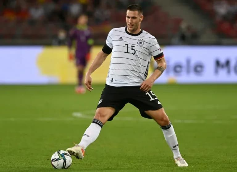 Player in Germany kit preparing to pass ball