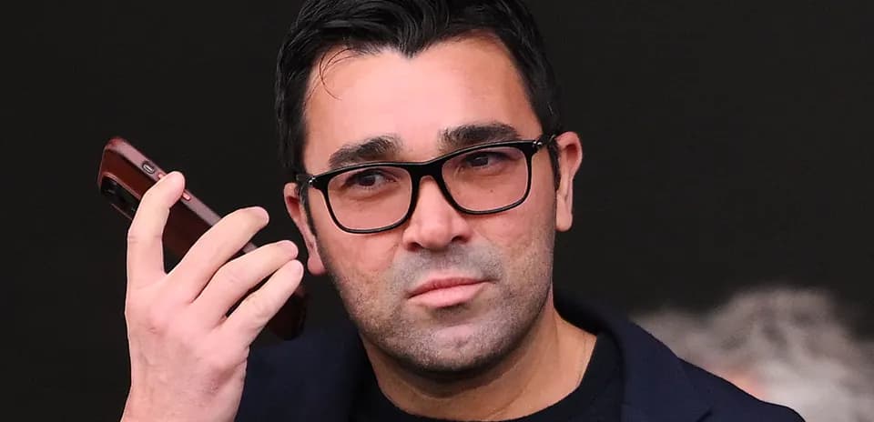 Man holding a phone, looking intently
