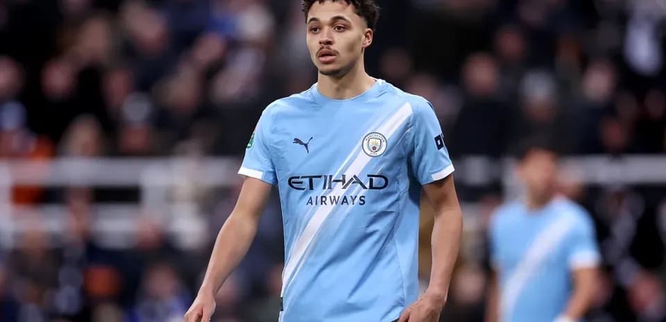 Player wearing Manchester City kit on the pitch