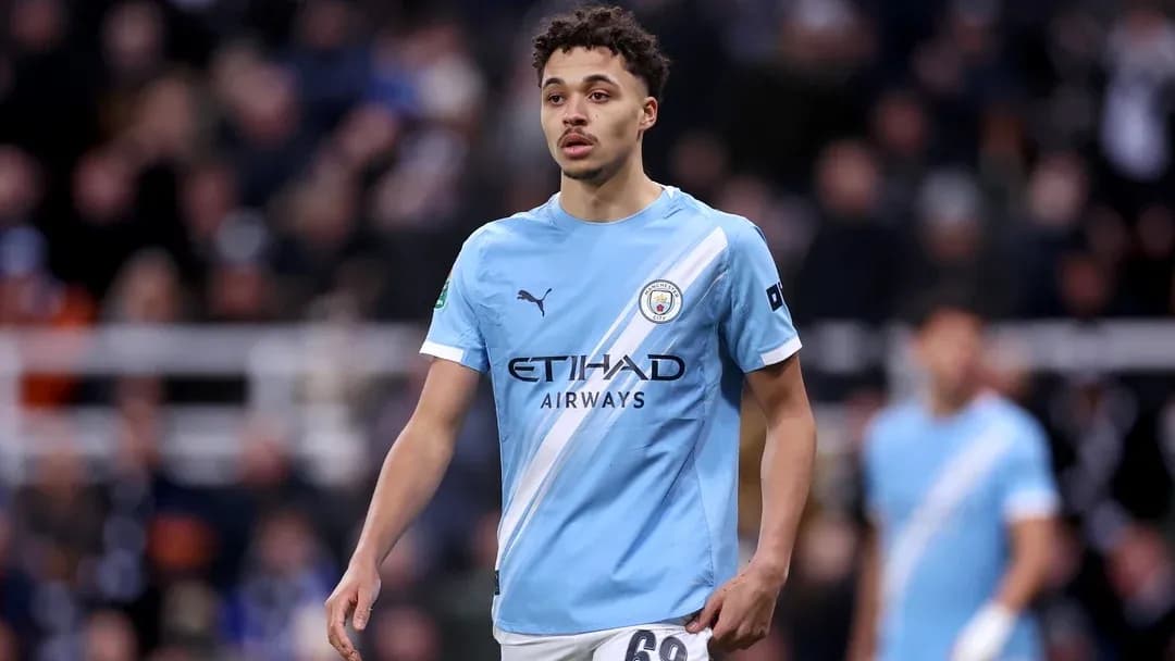 Player wearing Manchester City kit on the pitch