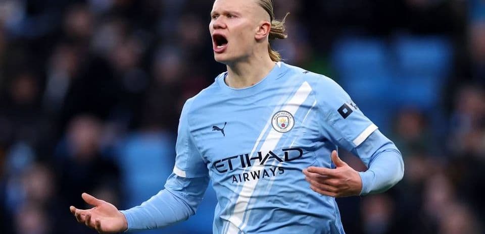 Player gesturing during a match for Manchester City
