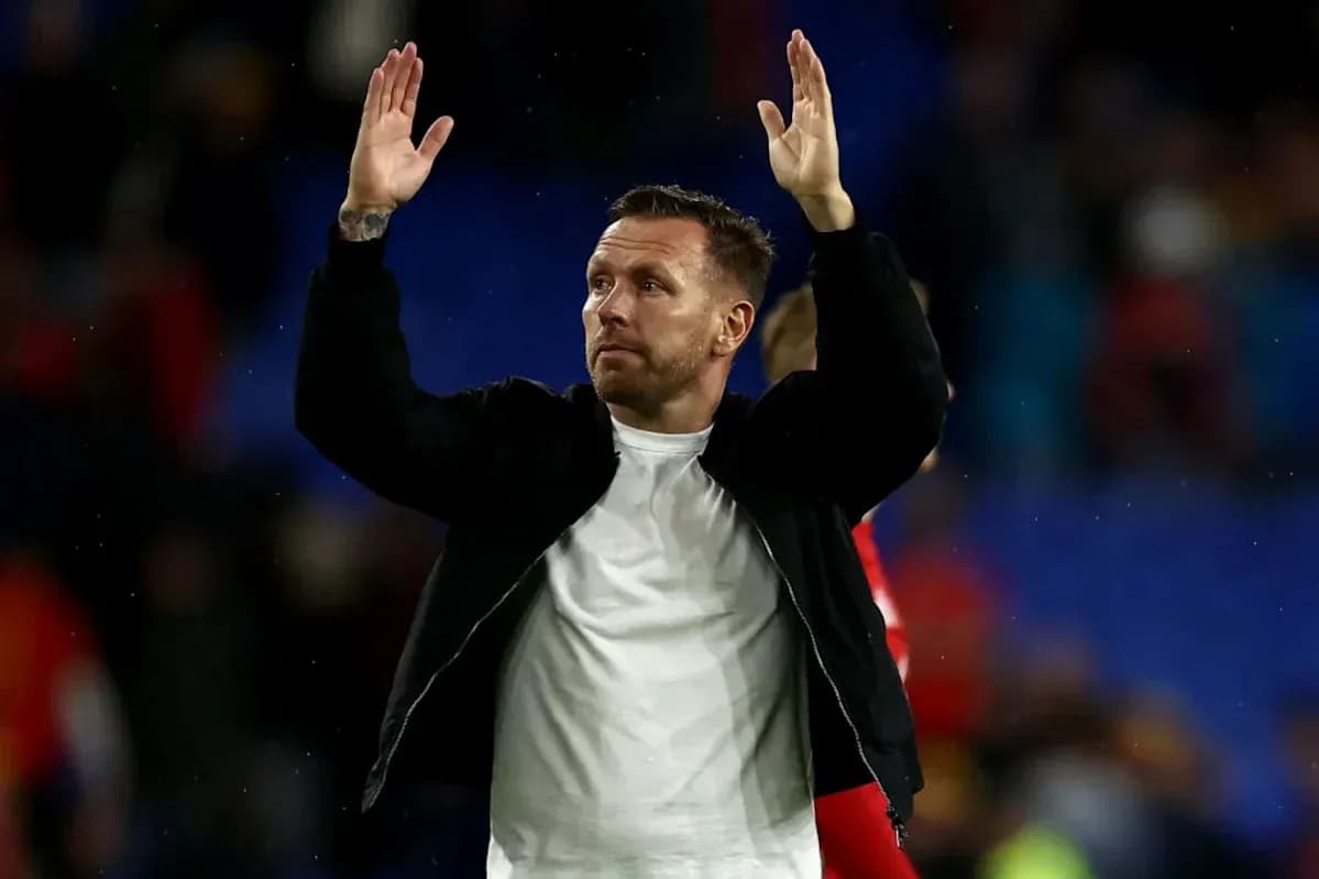 Man applauding fans after a match
