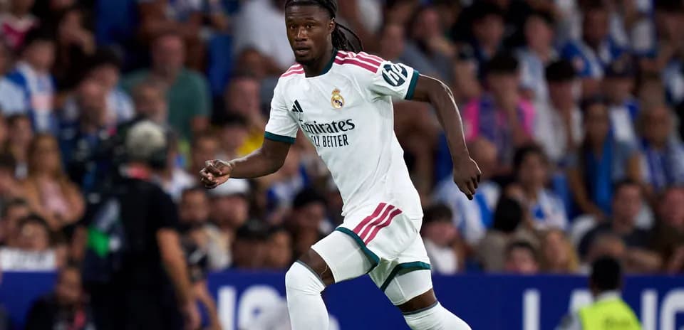 Player running during a match in white jersey