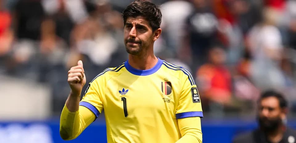 Goalkeeper in yellow jersey gesturing on the field