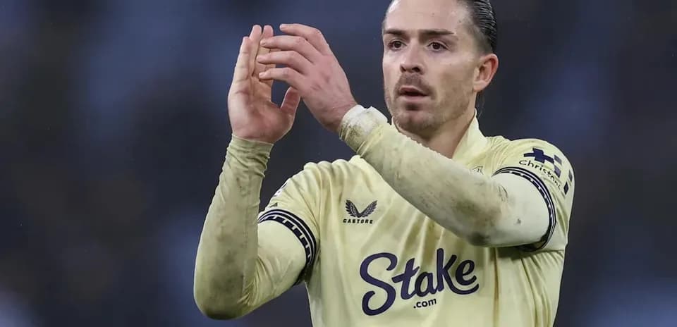 Player applauding fans wearing yellow team jersey