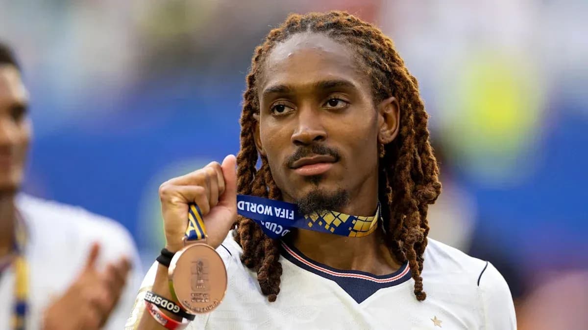 Player holding FIFA World Cup bronze medal