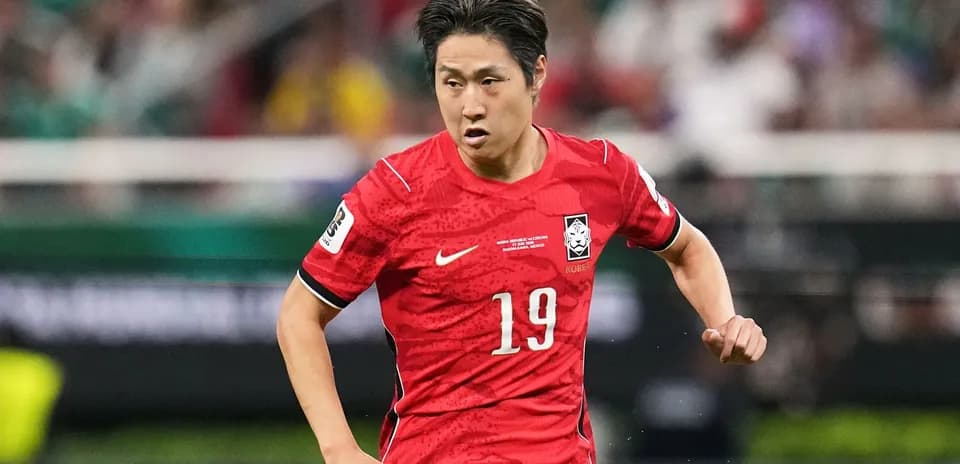 Player in red jersey sprinting on the field