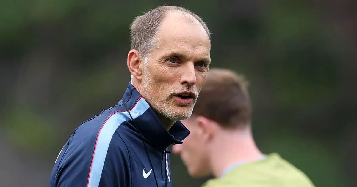 Coach speaking during training session with players