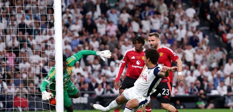 Players celebrating after a goal in the match.