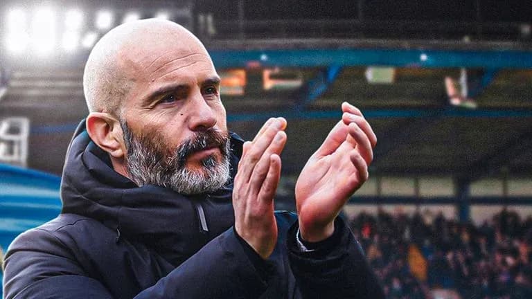 Manager applauding fans in stadium stands