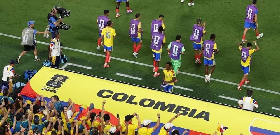 Colombia players celebrating with fans