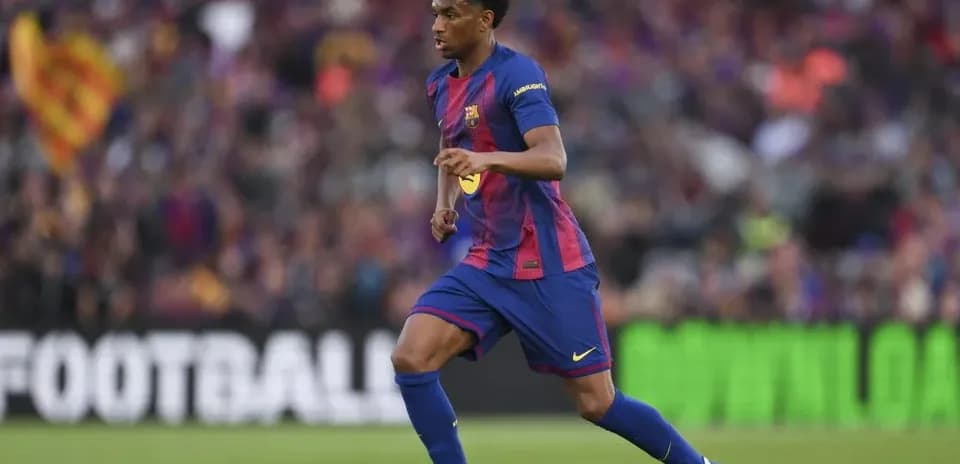 Barcelona player dribbling the ball during match