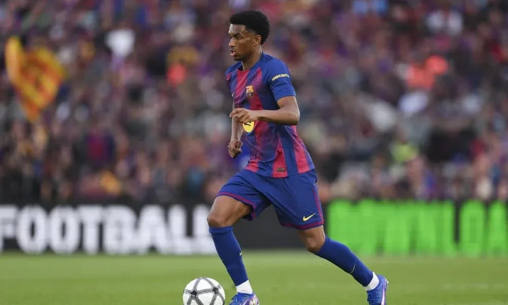 Barcelona player dribbling the ball during match