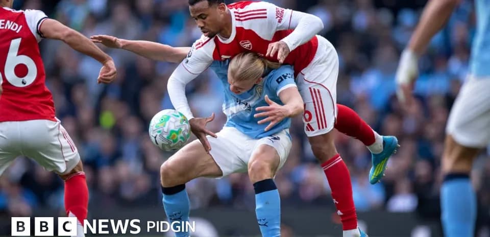 Player from Arsenal tackling Manchester City opponent