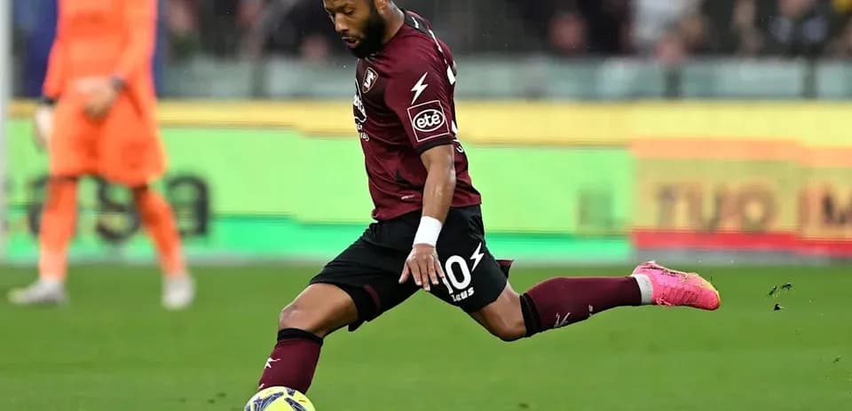 Player kicking the ball during a football match