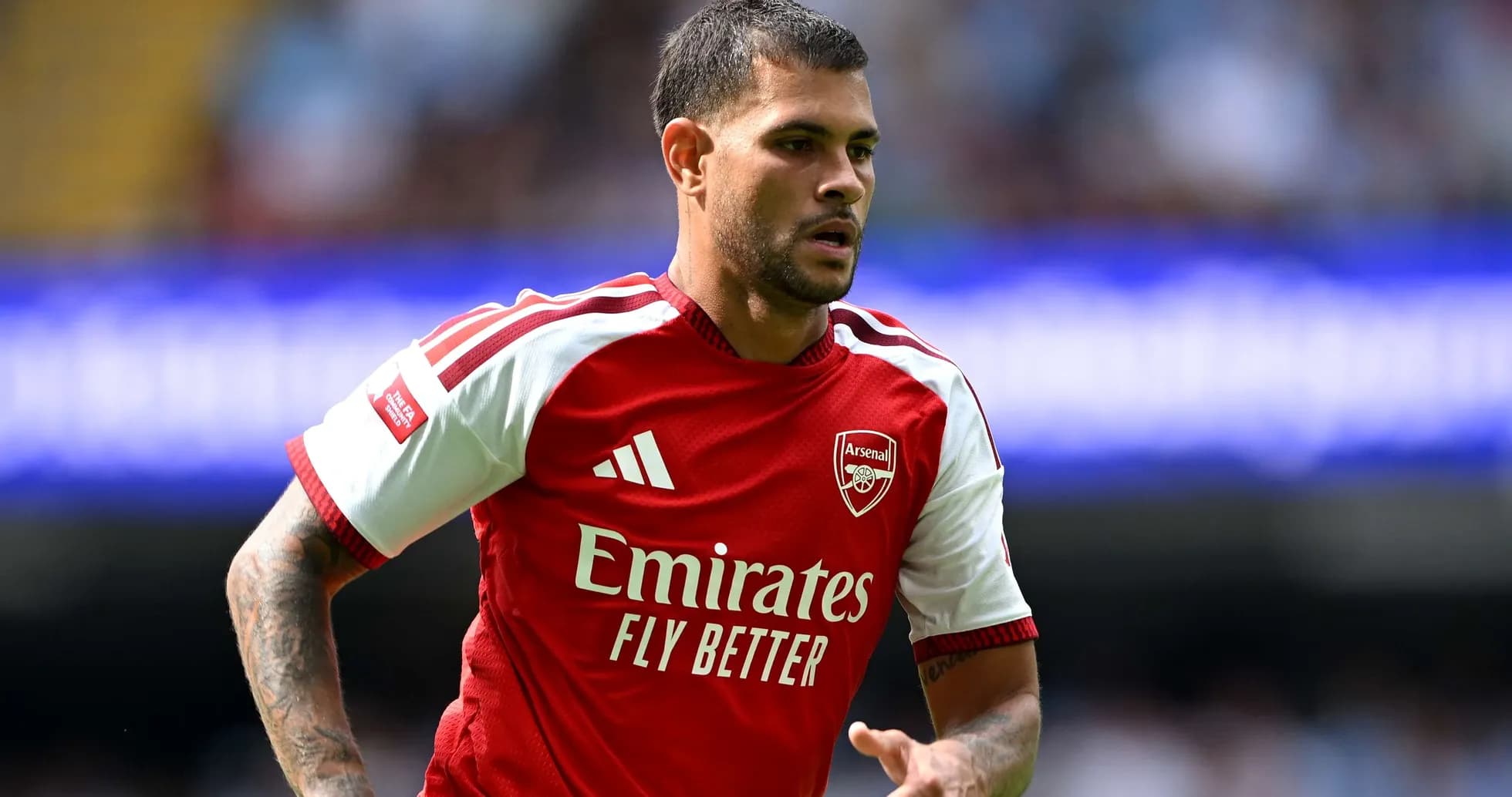 Arsenal player running during Premier League match