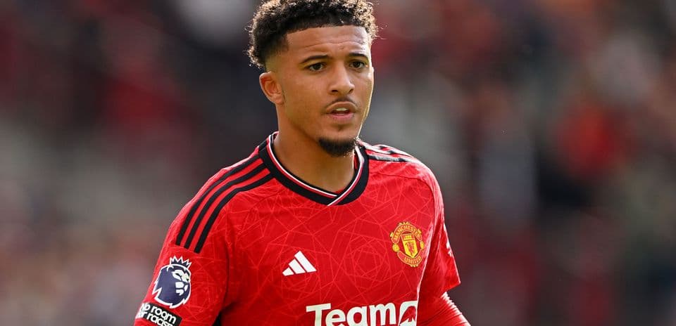 Player wearing Manchester United jersey on field