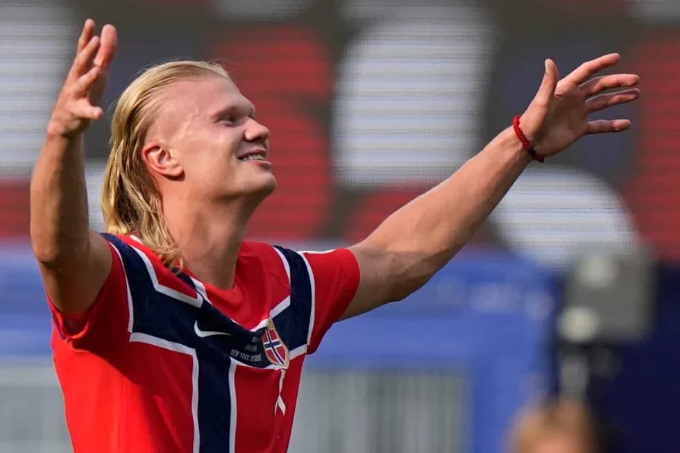 Player celebrating with arms raised during match