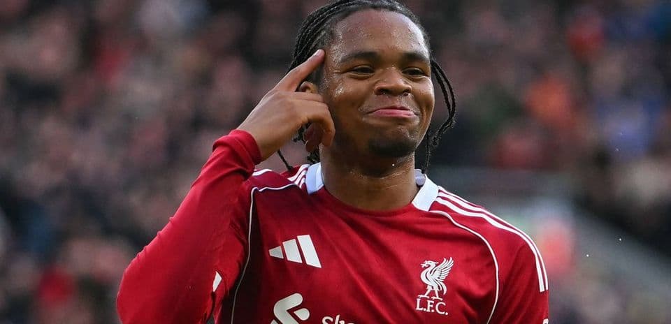 Player celebrating a goal with a hand gesture