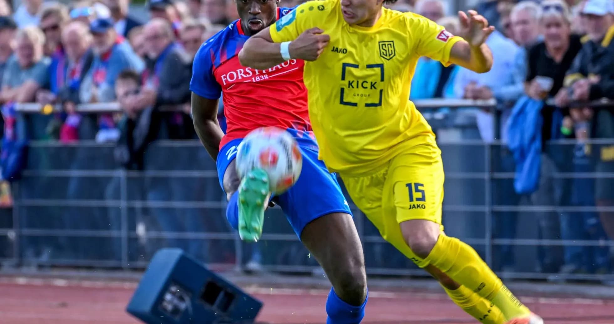Players contesting for the ball in Oberliga match