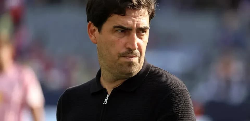 Coach observing players before the match