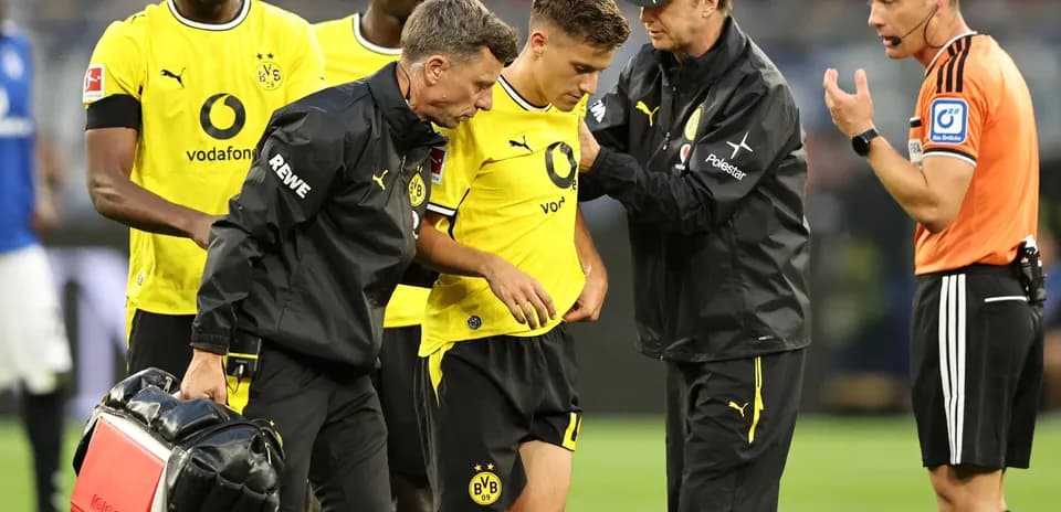 Medical staff attending to injured Borussia Dortmund player