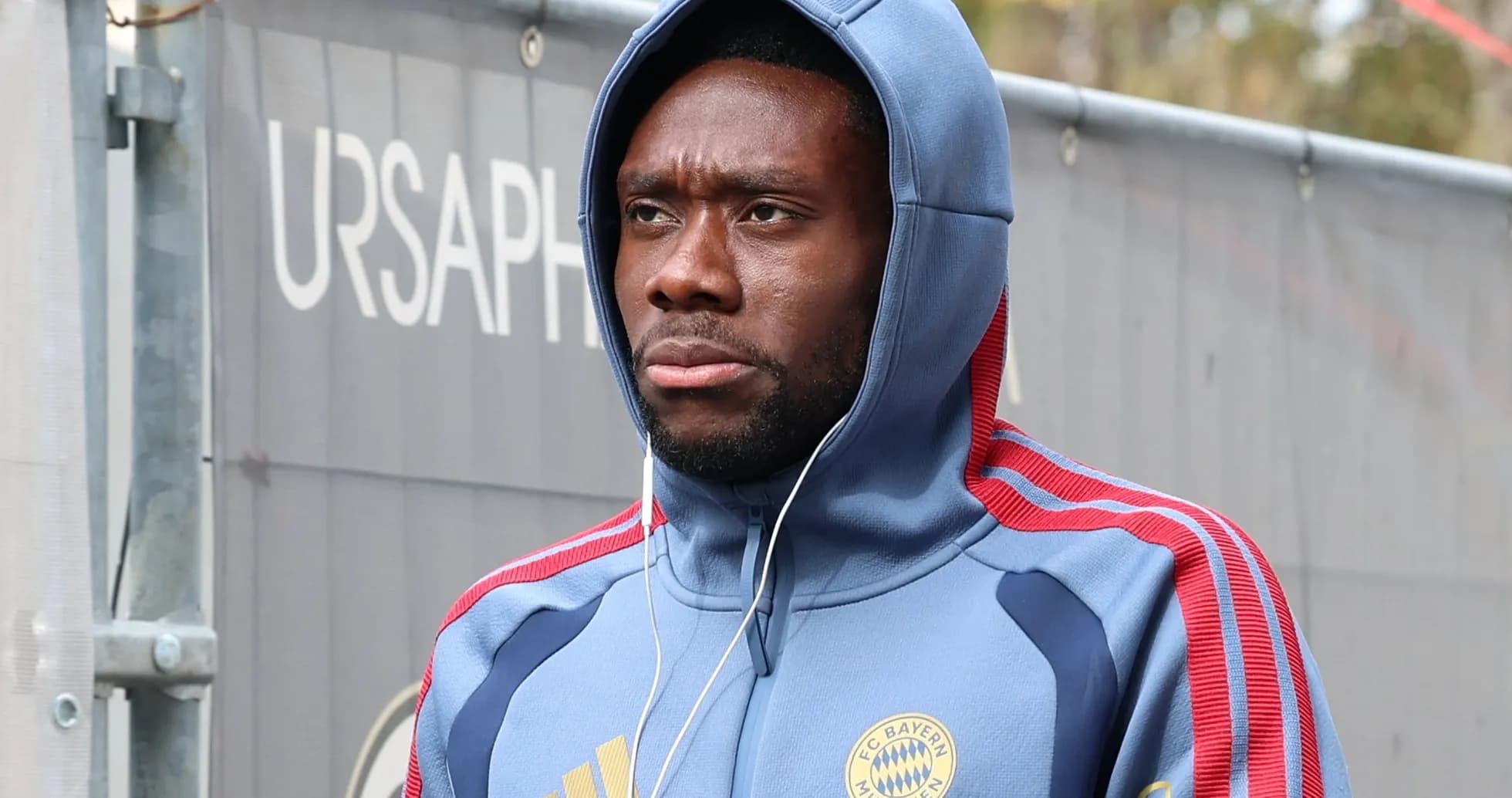 Player wearing Bayern Munich hoodie with headphones