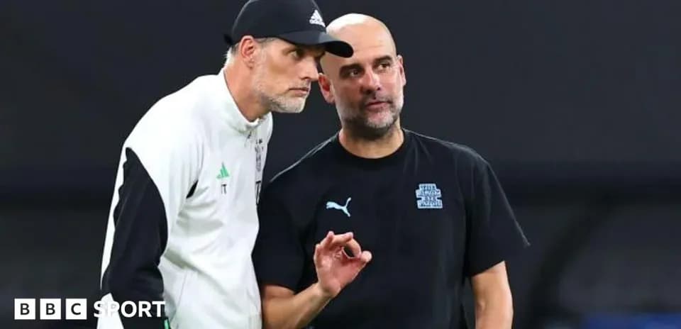 Two football managers discussing strategies on the pitch