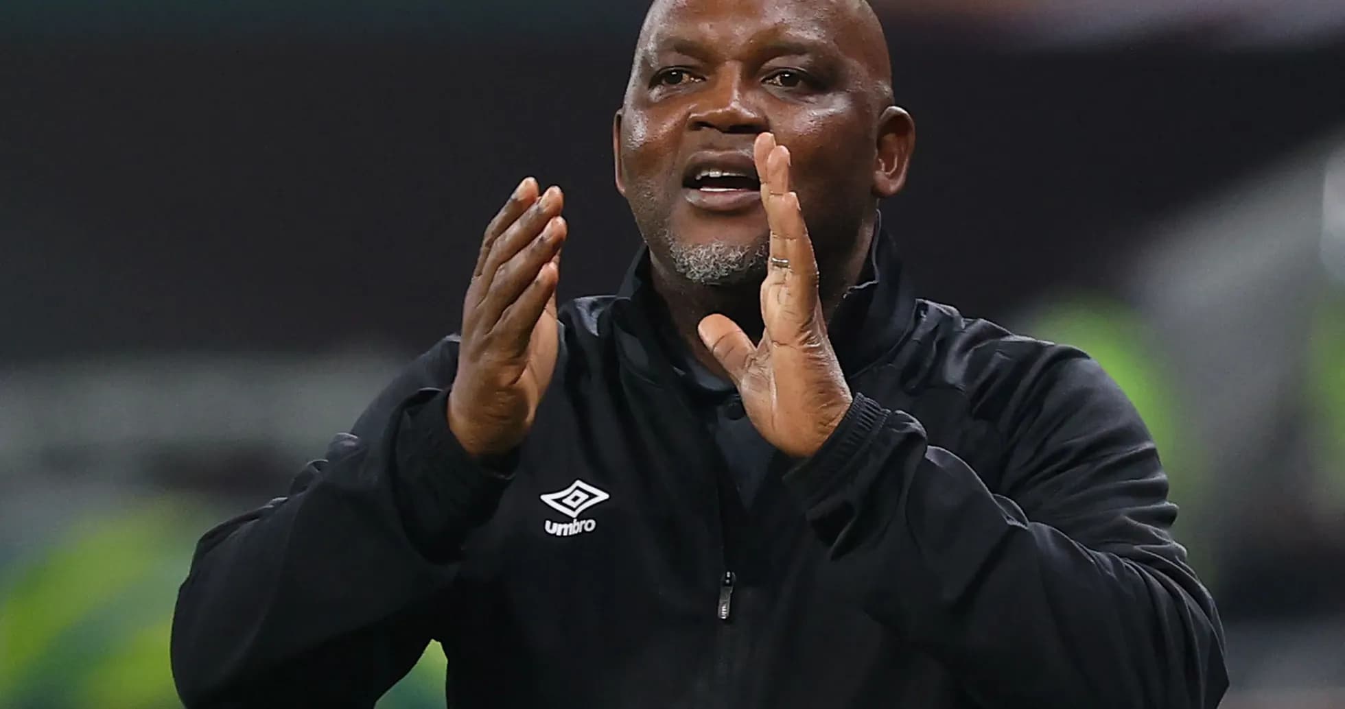 Coach directing players during a match