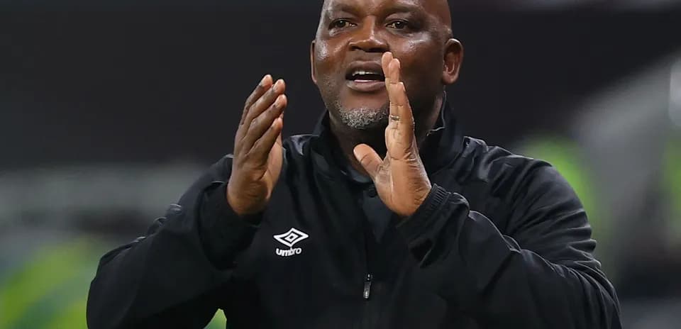 Coach directing players during a match