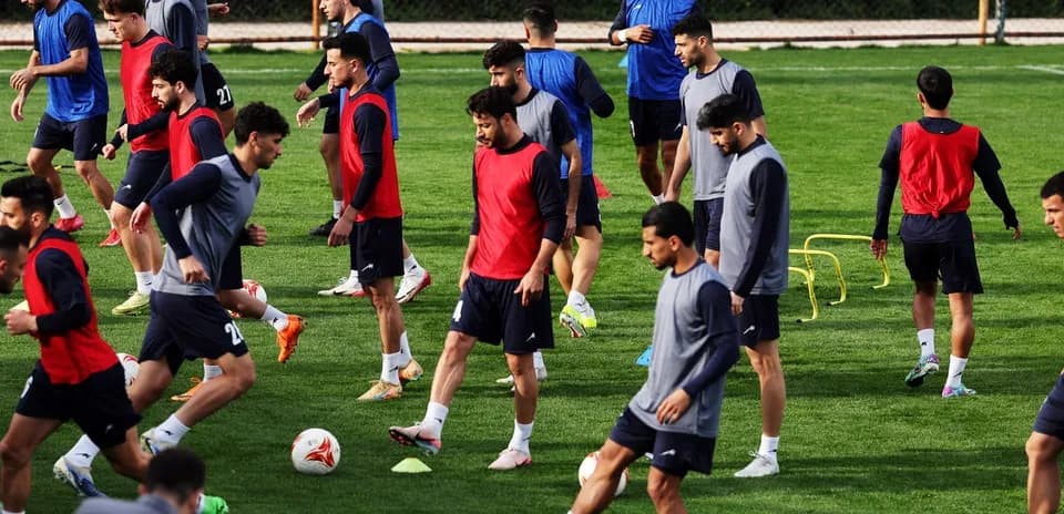 Players training on the pitch during practice session