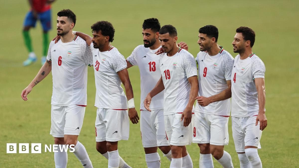 Iranian football players celebrating together on the field
