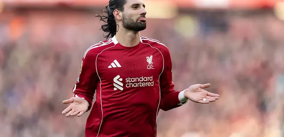 Player gesturing during a match in red kit