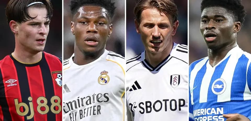 Four football players from different clubs in action