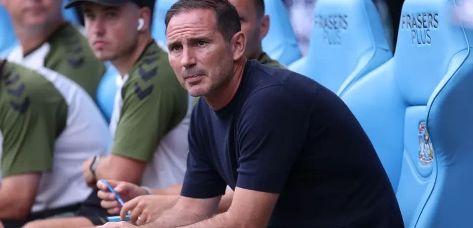 Coach sitting on the bench during a match