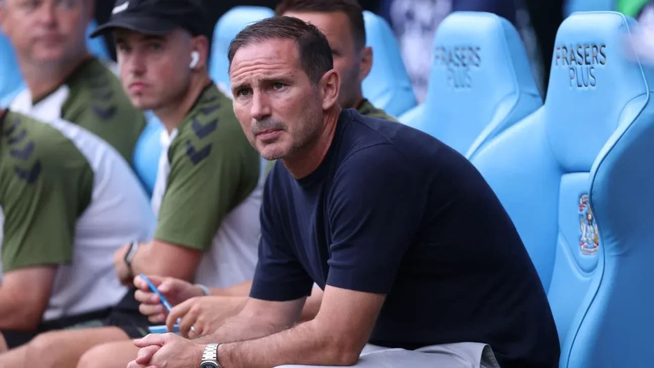 Coach sitting on the bench during a match