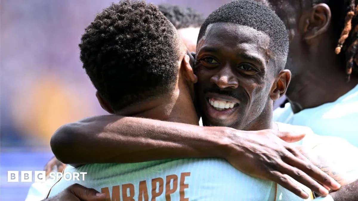 Players celebrating with a hug on the field
