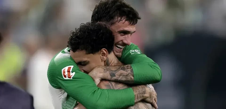 Two players embracing after a match celebration