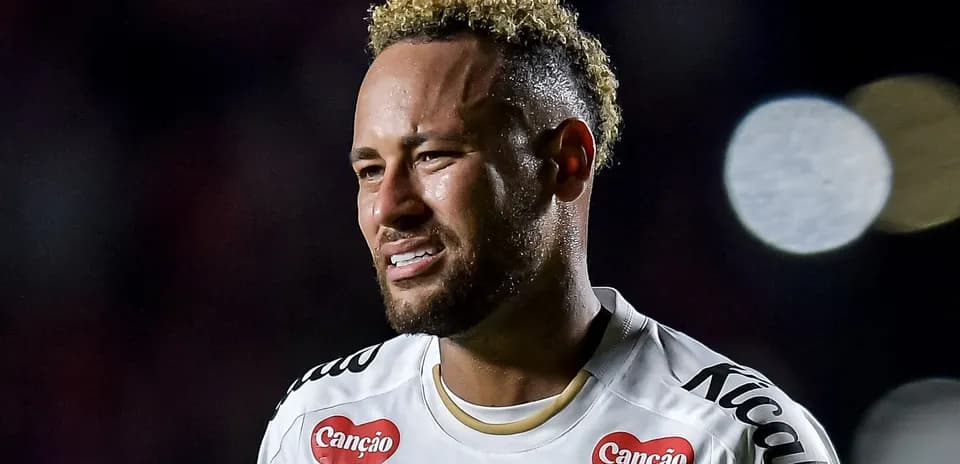 Football player in white kit during match