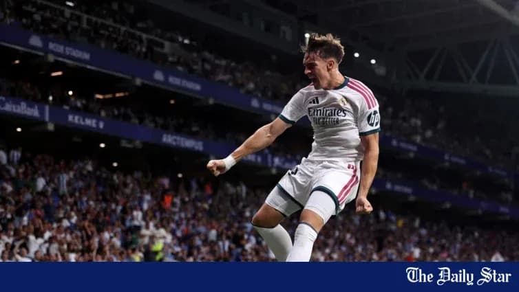 Real Madrid player celebrating a goal on field