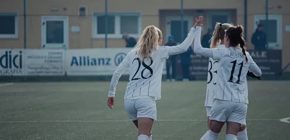 Players celebrating a goal during match