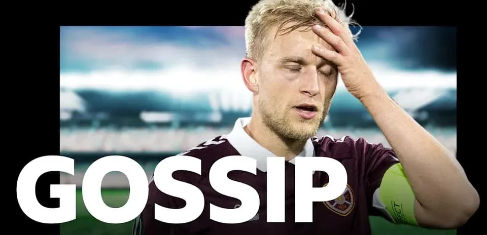 Player in maroon kit with hand on forehead
