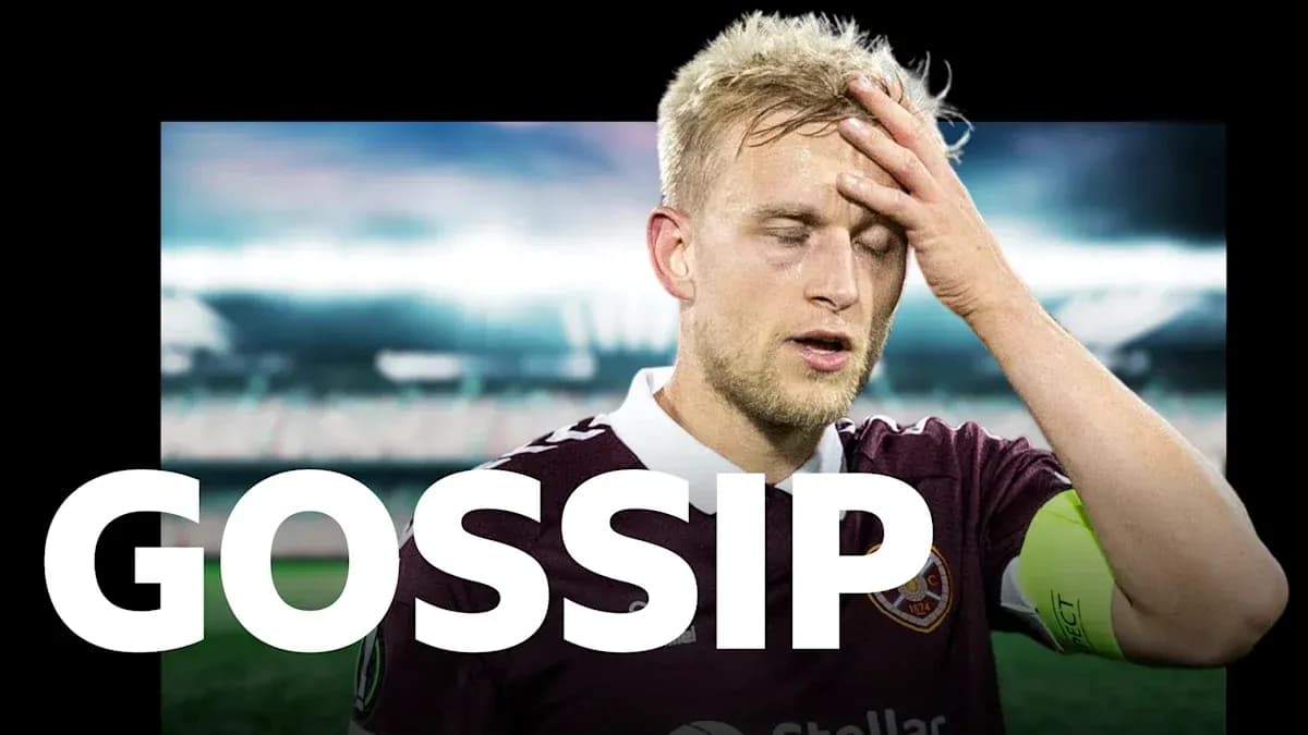 Player in maroon kit with hand on forehead