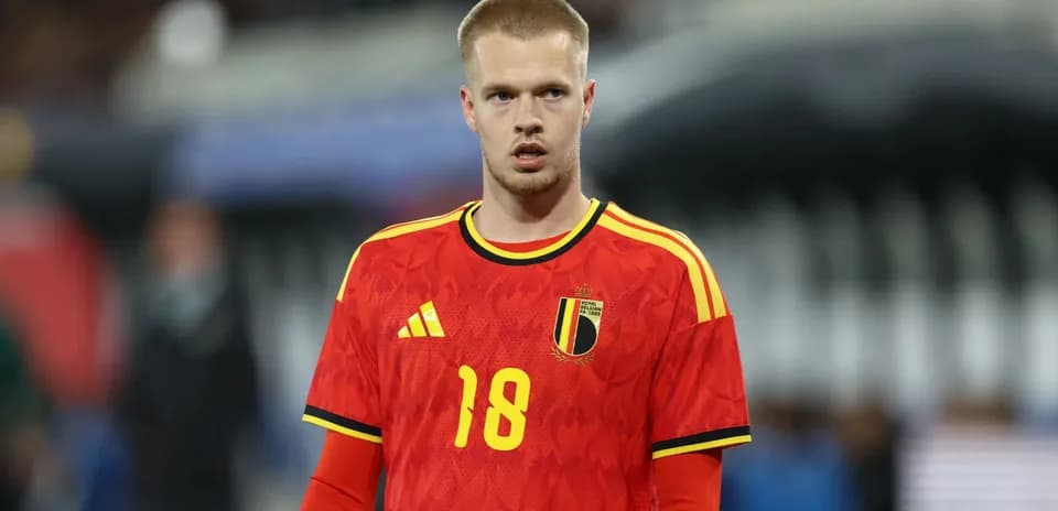 Player wearing Belgium national team jersey on field