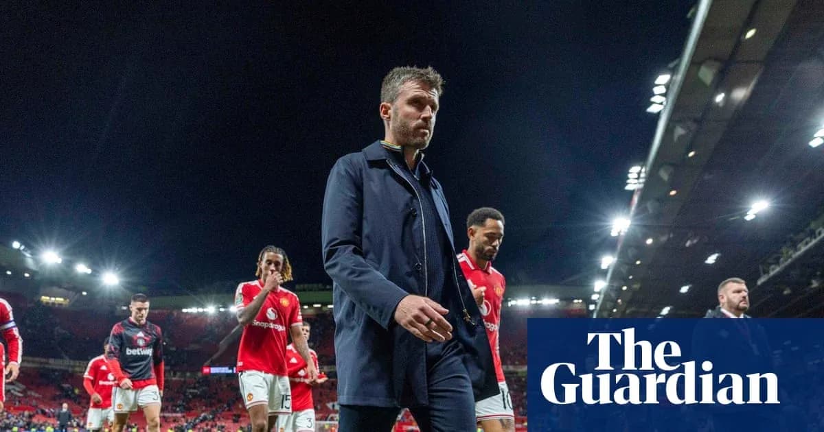 Manager walking off pitch with players after match