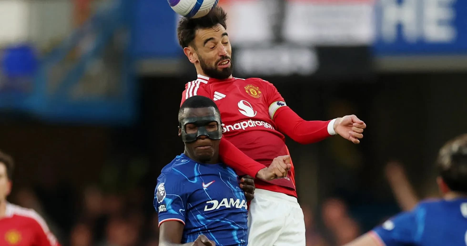 Bruno Fernandes and player competing for the ball