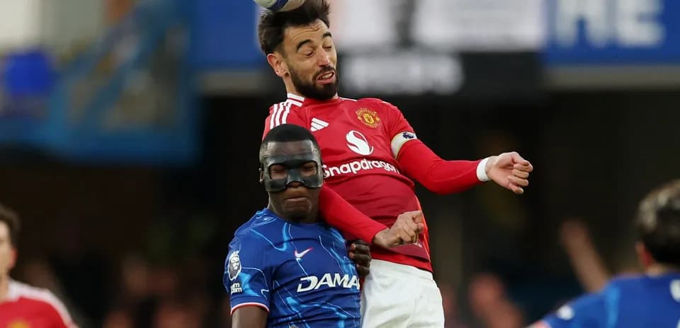Bruno Fernandes and player competing for the ball